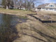 Eroded shoreline with only grass